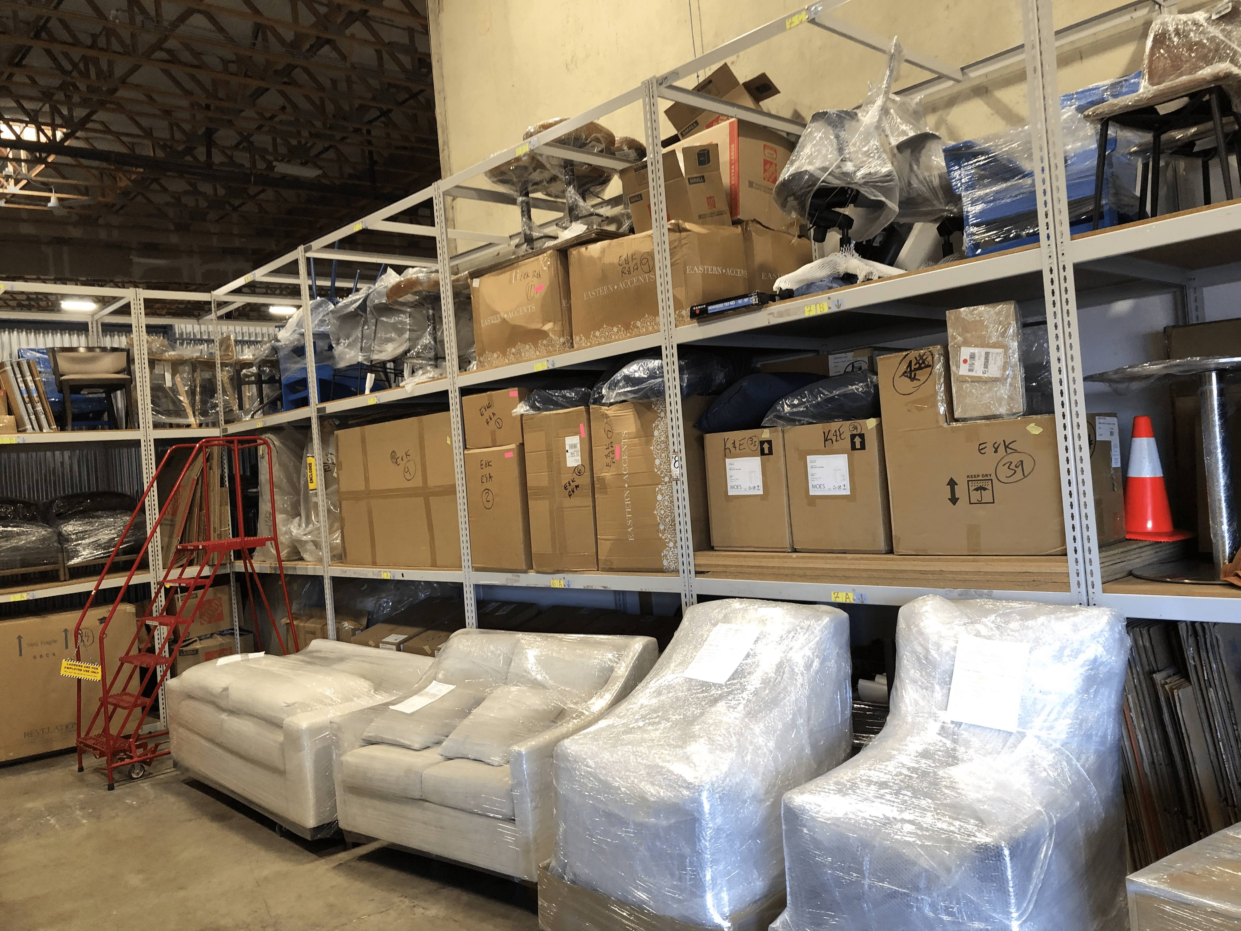 Wrapped furniture organized inside the Elmer's Express warehouse